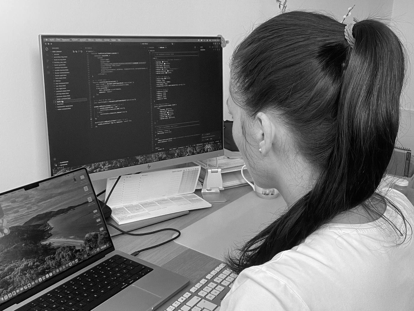 Jana Schmidt at her desk working on web design and podcast editing